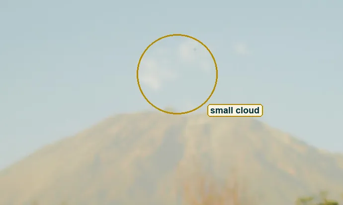 Crop of the summit with the small cloud just above it circled