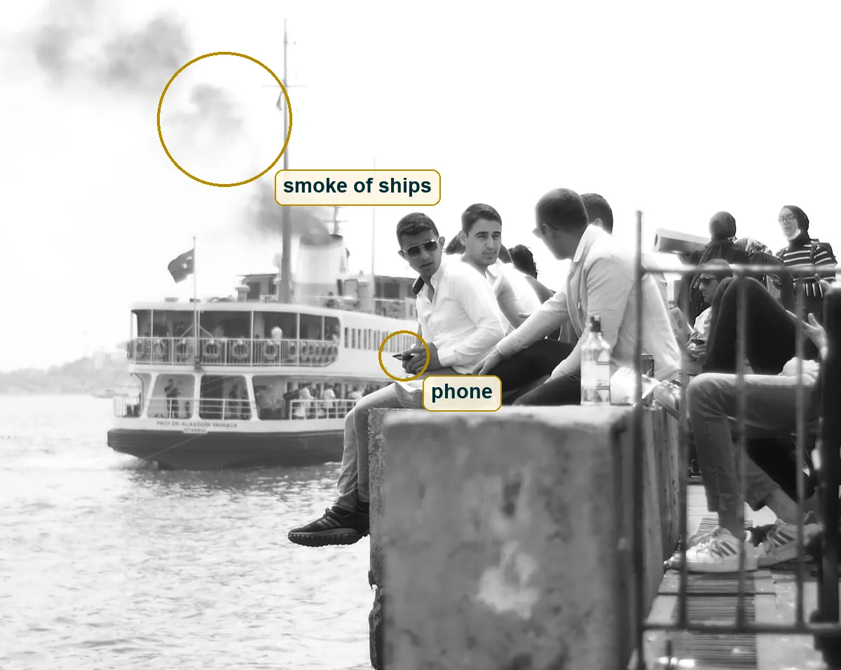 Full photo with the ship smoke and the phone in the hand marked