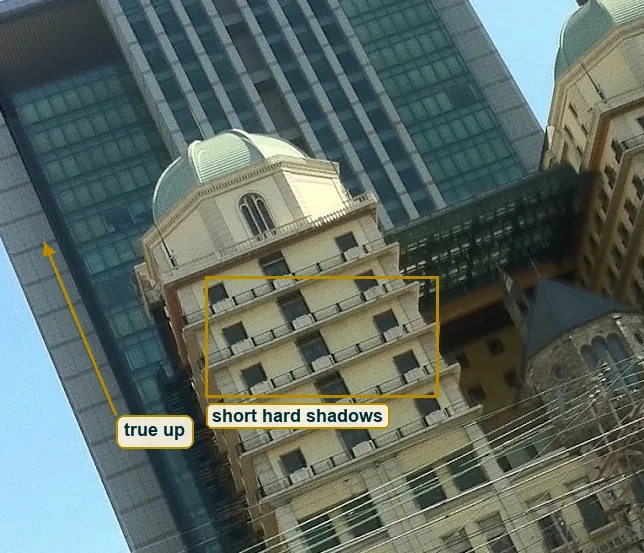 Crop of the left tower with the short balcony shadows boxed and true up marked