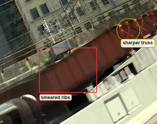 Pixel level crop of the red girder with smeared ribs boxed and the sharper truss circled