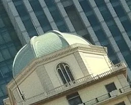 Pixel level crop of the left dome against the glass tower