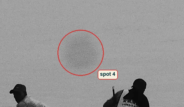 Crop of the water above the stern with a soft dark spot circled
